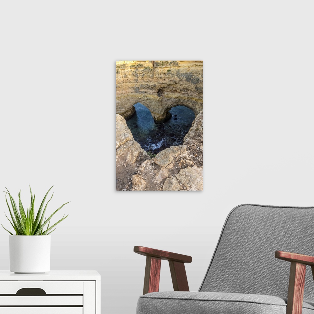 A modern room featuring Portugal. Heart-shaped rock design on shore.