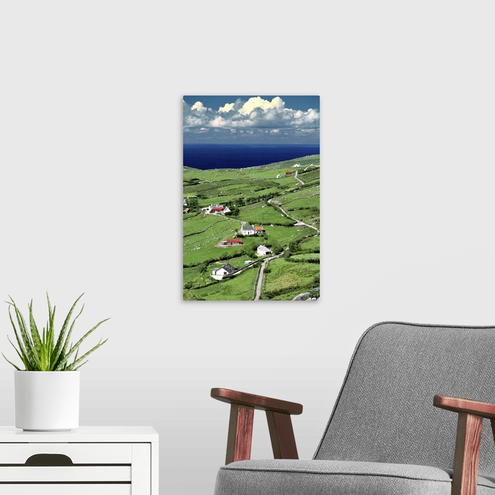 A modern room featuring Europe, Ireland, Ring of Kerry. Red-roofed homes interrupt the green of Ring of Kerry, in County ...
