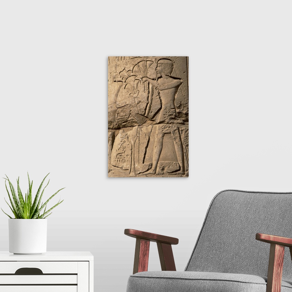 A modern room featuring EGYPTIAN ART. Relief depicting a pharaoh making an offering of papyrus flowers to the gods. FIRST...
