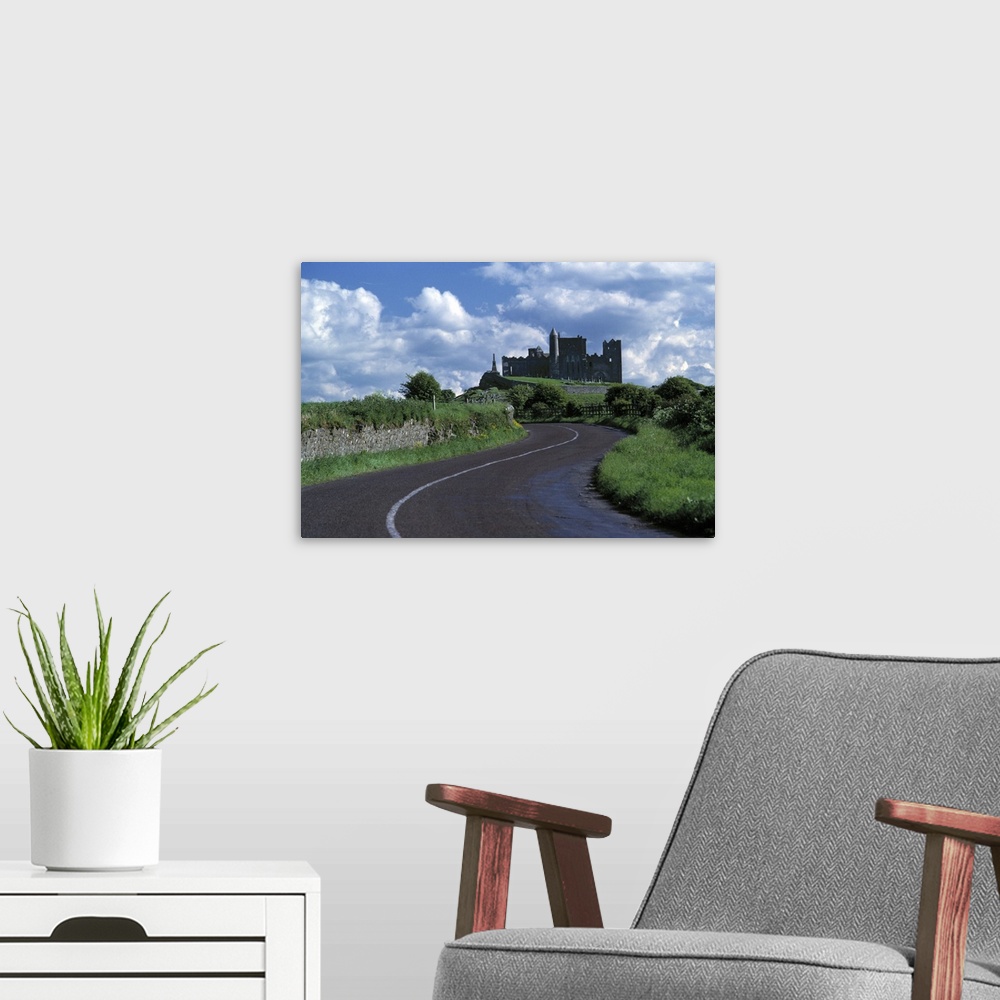 A modern room featuring Europe, Ireland, Cashel. The stately Rock of Cashel stands darkly against a sky bright with cloud...