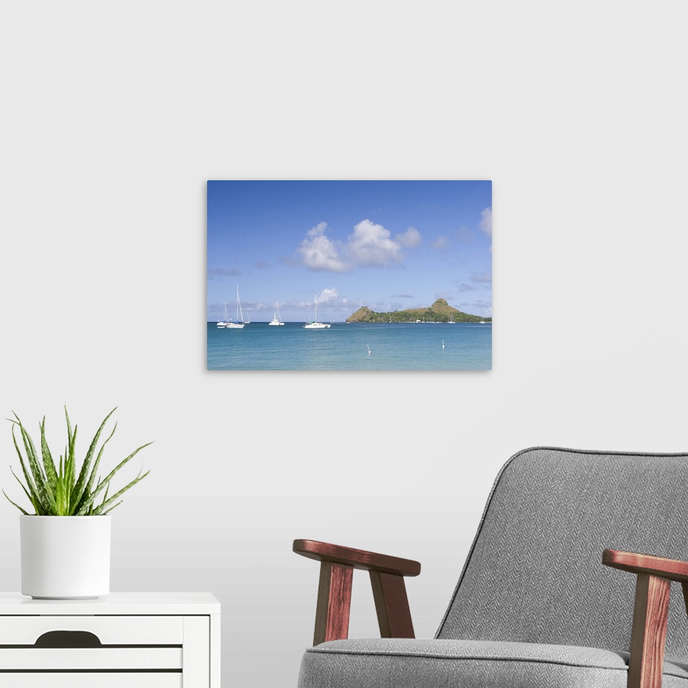 A modern room featuring Sailboats anchored off of Reduit beach on the island of St. Lucia in the southern Caribbean.