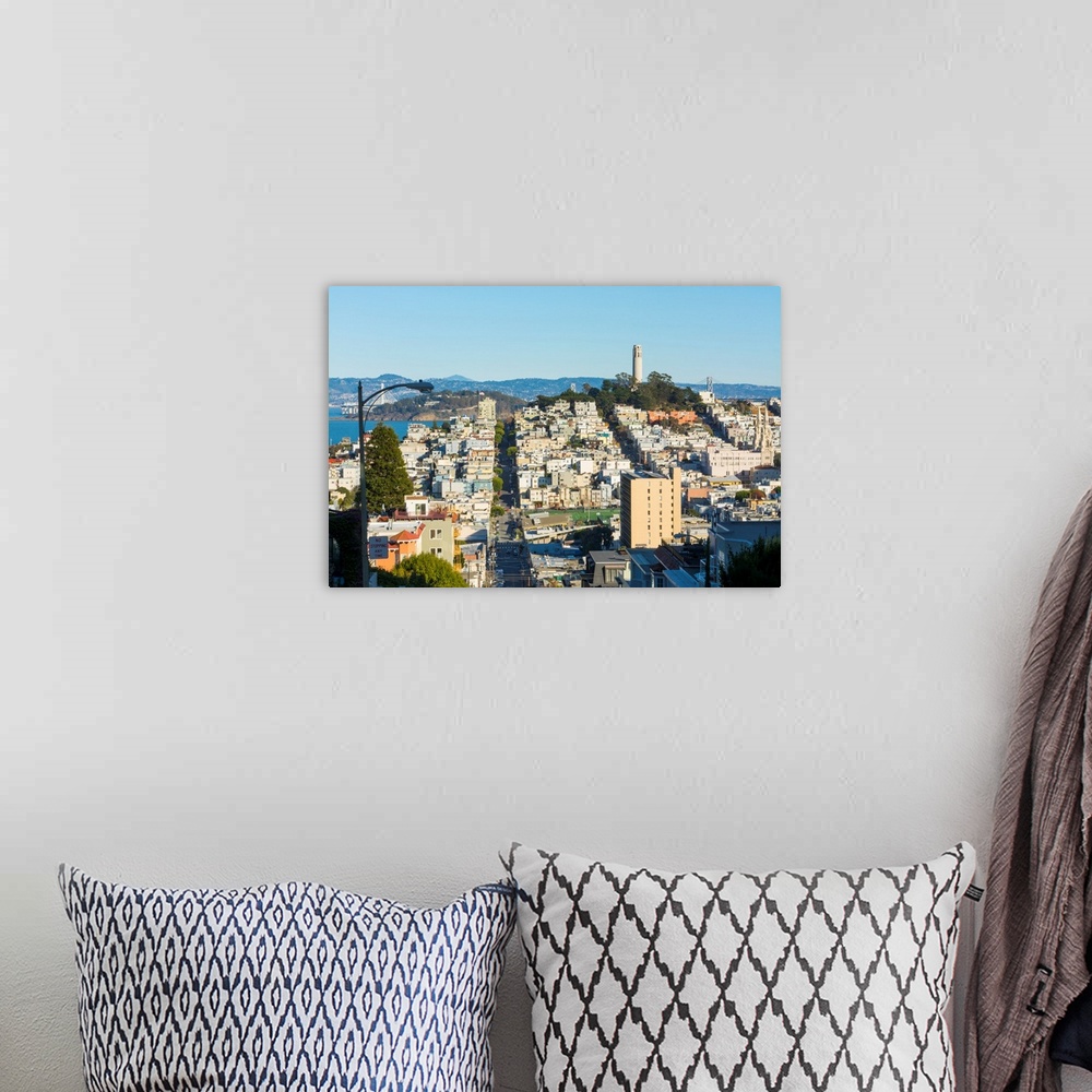 A bohemian room featuring San Francisco California hills of the city and Coit Tower in sunshine with streets and bridges in...