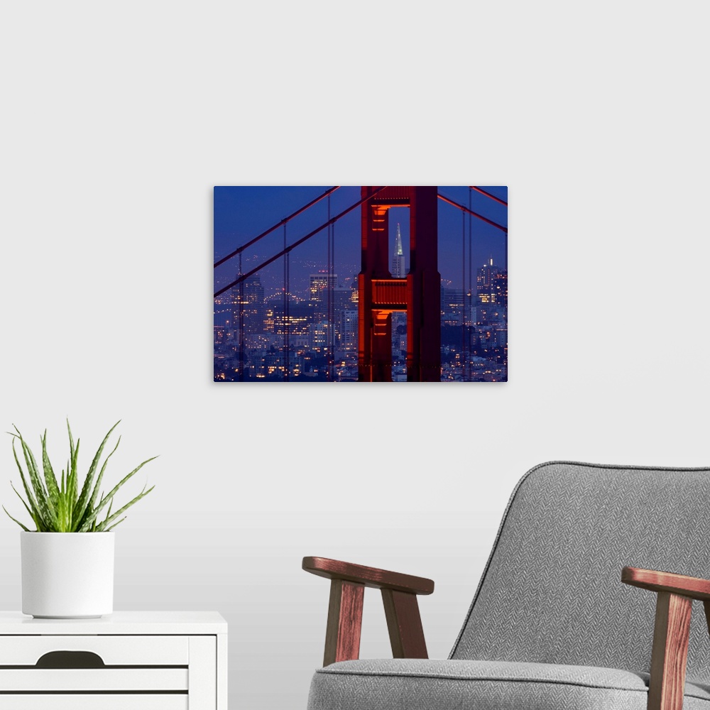 A modern room featuring A dusk view of San Francisco with the Transamerica building through the Golden Gate Bridge.