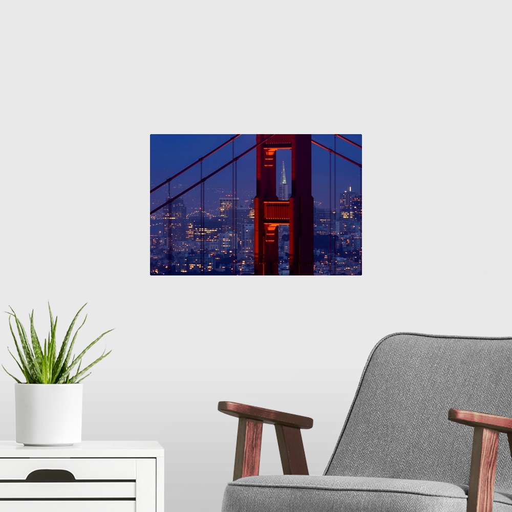 A modern room featuring A dusk view of San Francisco with the Transamerica building through the Golden Gate Bridge.