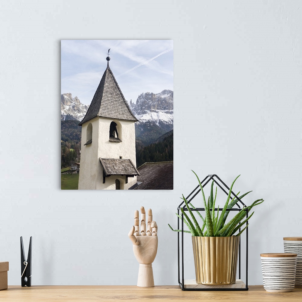 A bohemian room featuring Sankt Zyprian near Tiers, in the background Rosengarten mountain range, Central South Tyrol, Italy.