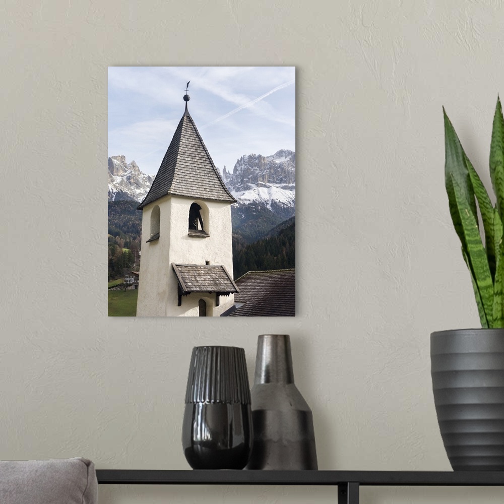 A modern room featuring Sankt Zyprian near Tiers, in the background Rosengarten mountain range, Central South Tyrol, Italy.
