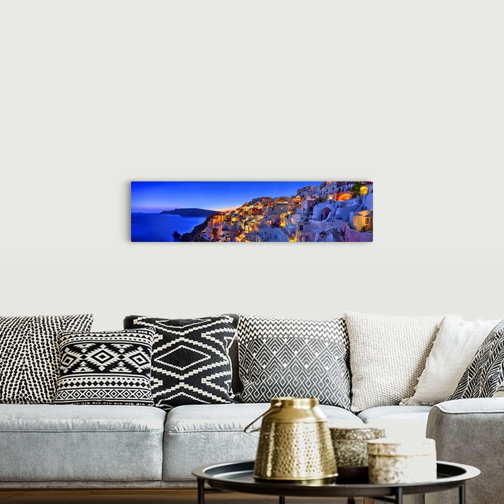A bohemian room featuring Santorini, Greece on the Mediterranean sea.