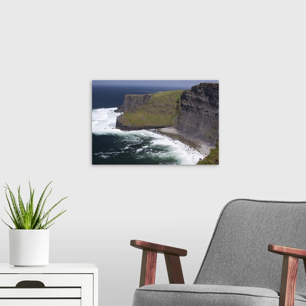 A modern room featuring Scenic Cliffs of Moher and beach with the Atlantic Ocean and choppy waves