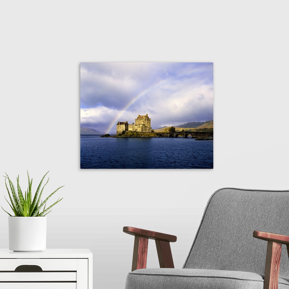 A modern room featuring Scotland, Highland, Wester Ross, Eilean Donan Castle. A rainbow frames beautiful Eilean Donan Cas...