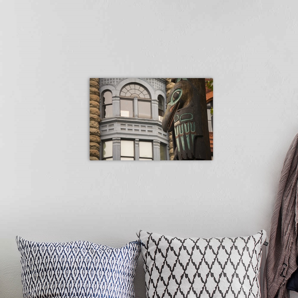 A bohemian room featuring Washington, Seattle, Totem pole and Pioneer building at historic Pioneer Square.