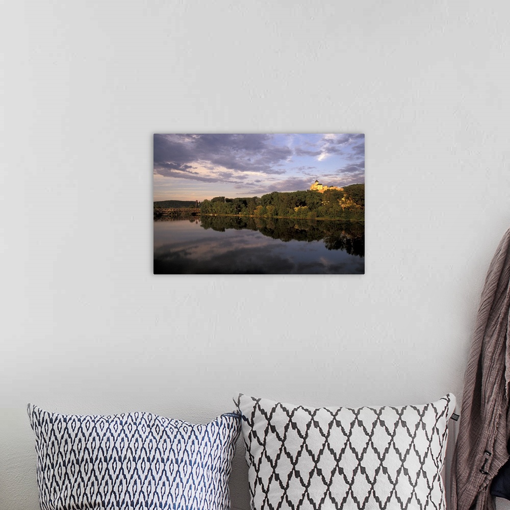 A bohemian room featuring Europe, Slovakia, West Slovakia, Trencin.Trencin Castle at sunset, reflected in Vah River