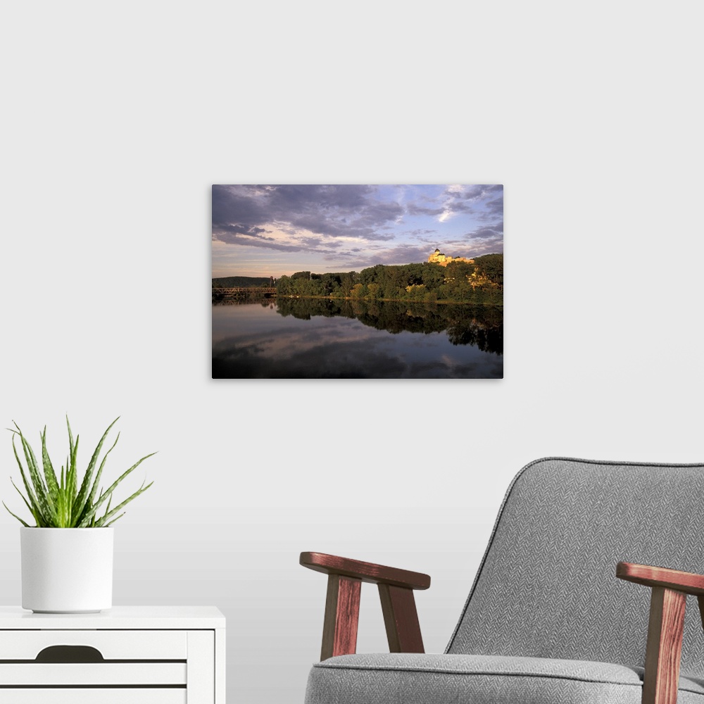 A modern room featuring Europe, Slovakia, West Slovakia, Trencin.Trencin Castle at sunset, reflected in Vah River