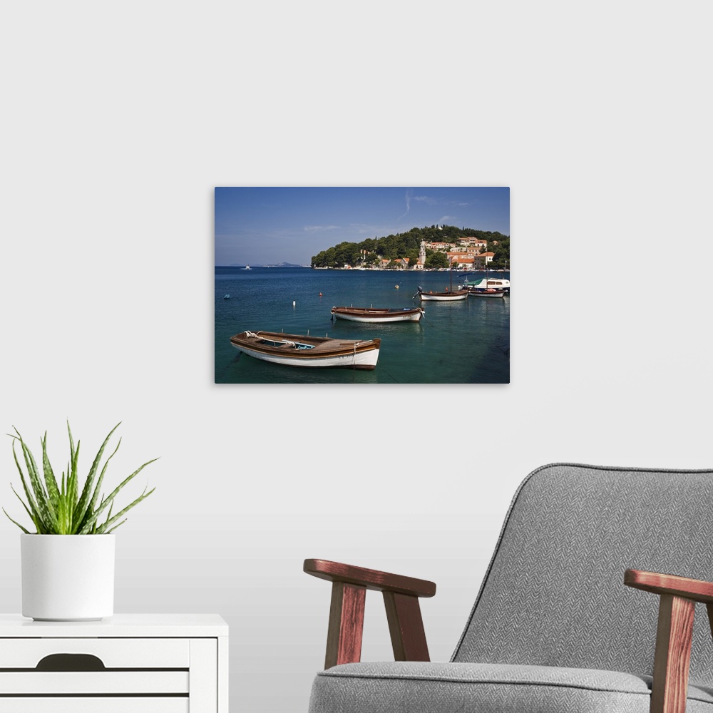 A modern room featuring Small boats docked in harbor, Hvar Island, one of the most famous Dalmatian Islands, Croatia