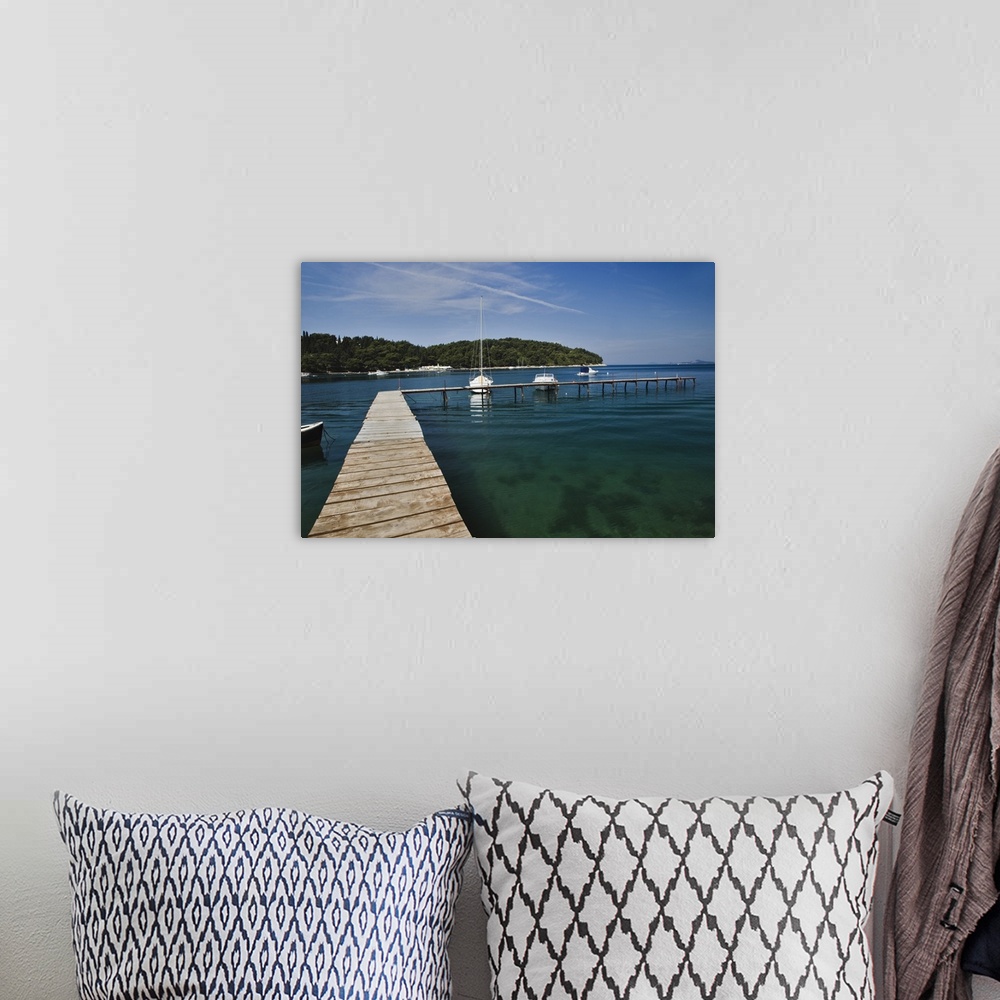 A bohemian room featuring Small dock and sailboat, Hvar Island, one of the most famous Dalmatian Islands, Croatia