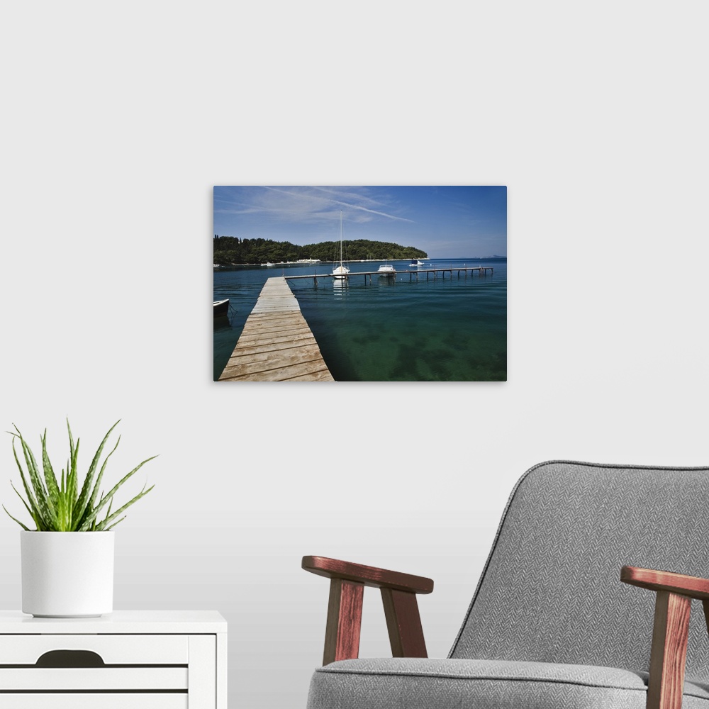A modern room featuring Small dock and sailboat, Hvar Island, one of the most famous Dalmatian Islands, Croatia