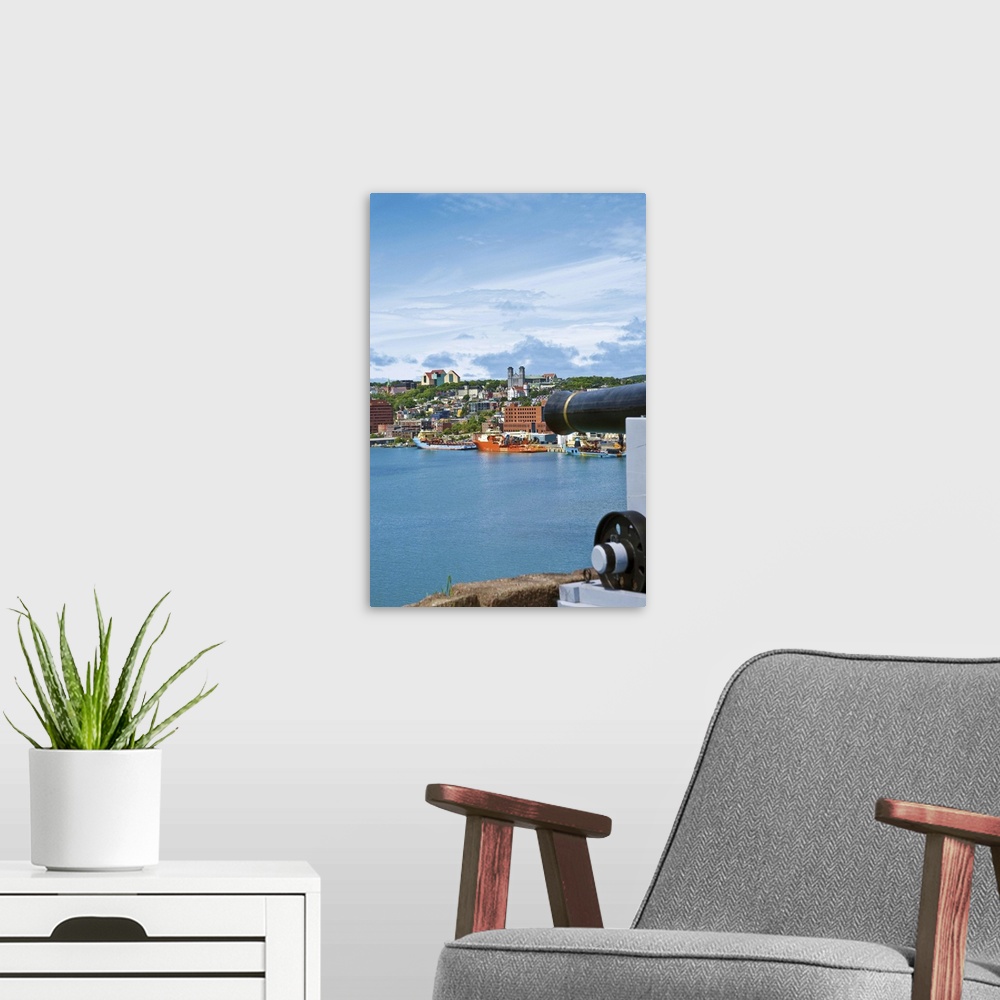 A modern room featuring St. John's, Newfoundland, Canada, the waterfront of St. John's as seen from near a cannon at Fort...
