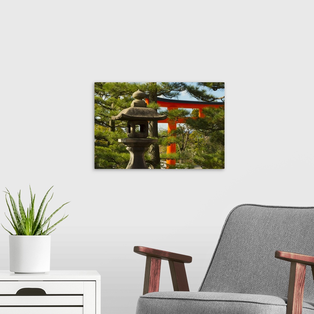 A modern room featuring Stone lantern and Torii gate in Fushimi Inari Shrine, Kyoto, Japan