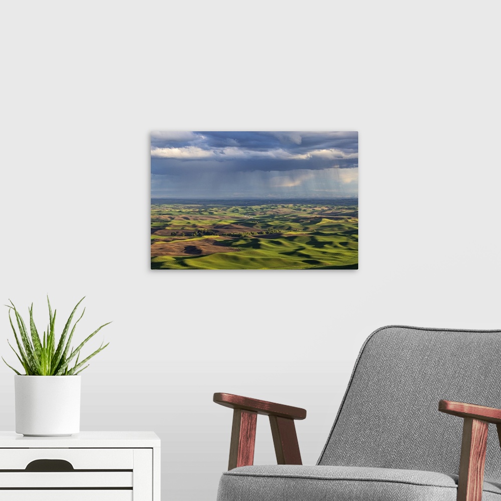 A modern room featuring Stormy clouds over rolling hills from Steptoe Butte near Colfax, Washington State, USA.