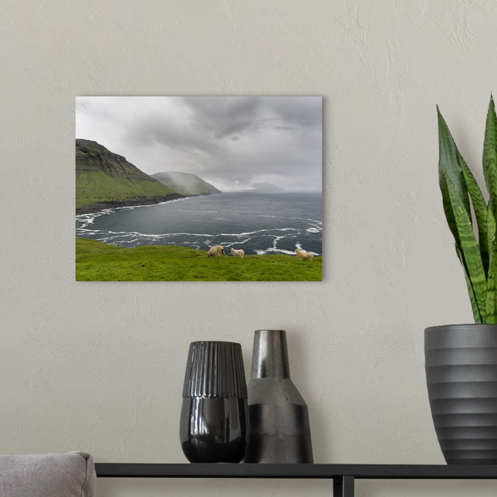 A modern room featuring The west coast at Nordradalur. The island Streymoy, one of the two large islands of the Faroe Isl...
