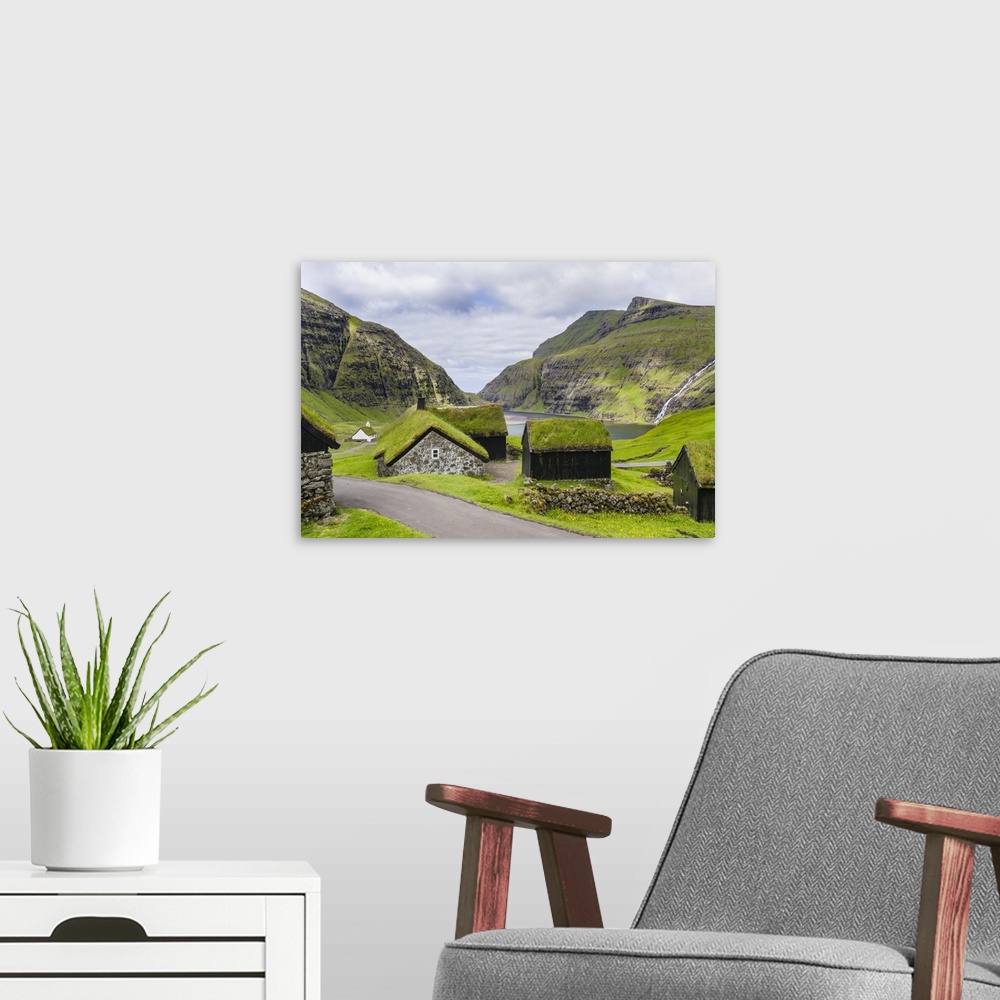 A modern room featuring Kings Farm (duvugardar) in the valley of Saksun, one of the main attractions of the Faroe Islands...