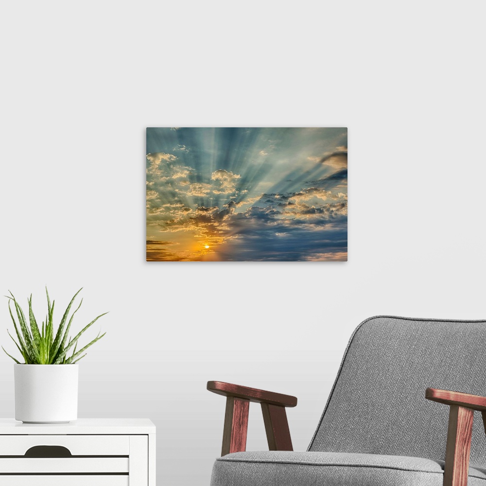 A modern room featuring Sunbeams streaming through clouds at sunset, Cincinnati, Ohio