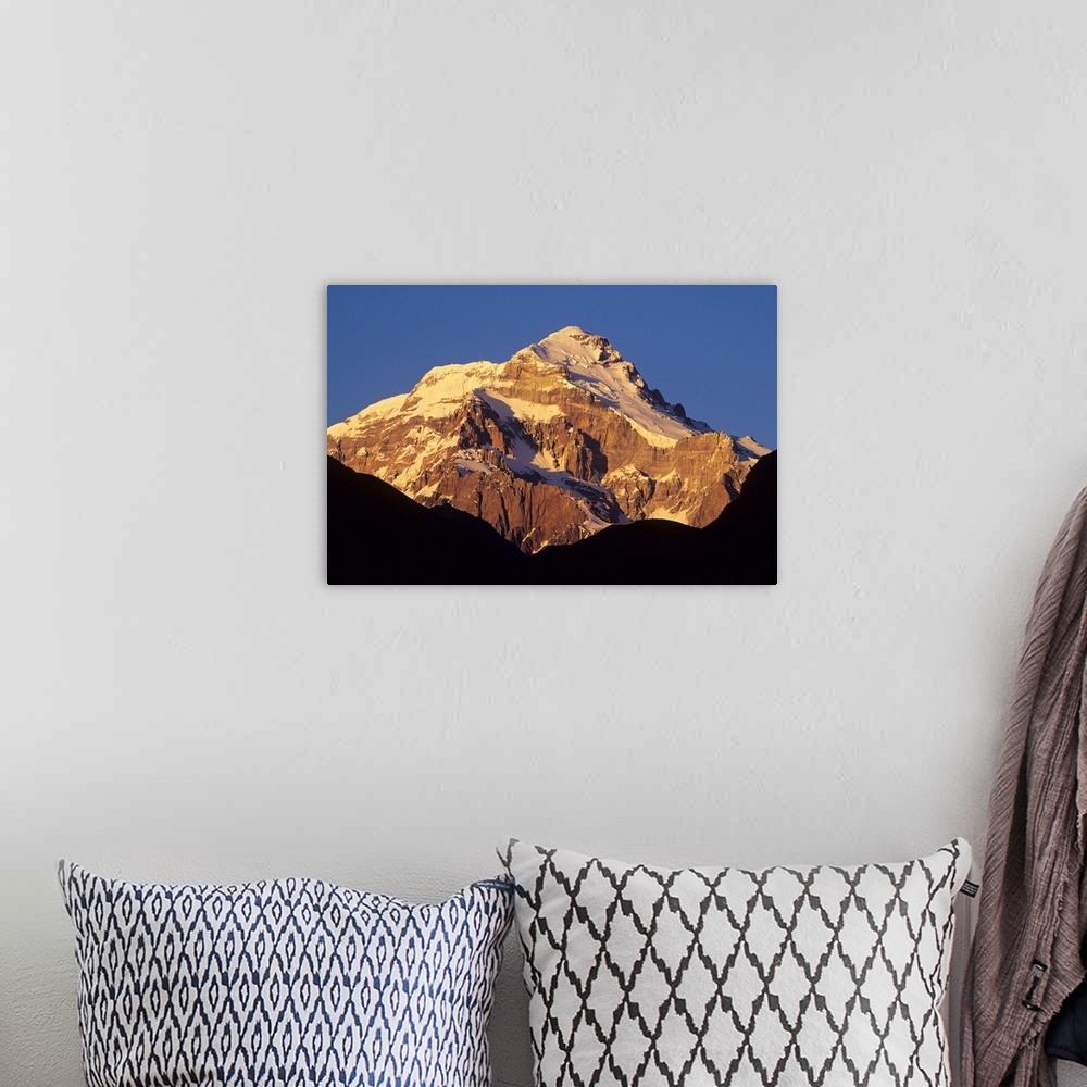 A bohemian room featuring Sunrise on east face of 22,841' Cerro Aconcagua, highest mountain in the Andes, viewed from the V...