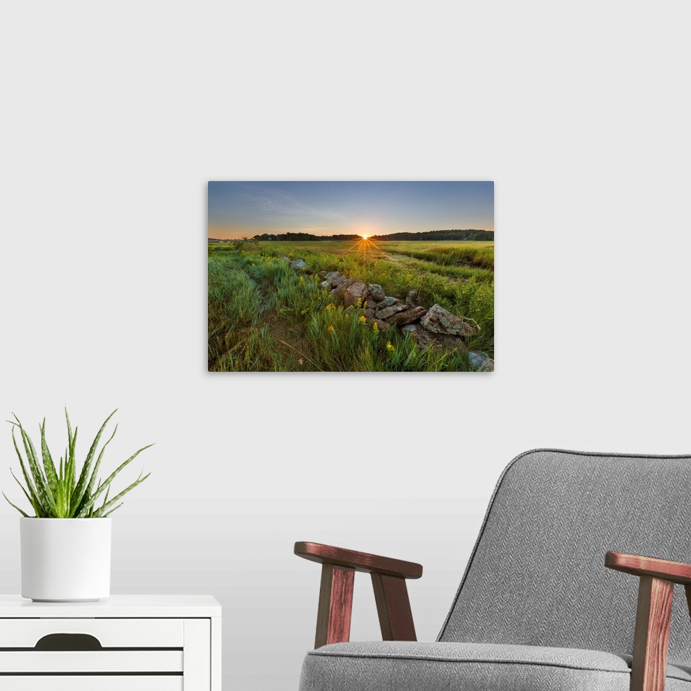 A modern room featuring Sunrise over the salt marsh along the Essex River at the Cox Reservation in Essex, Maassachusetts.