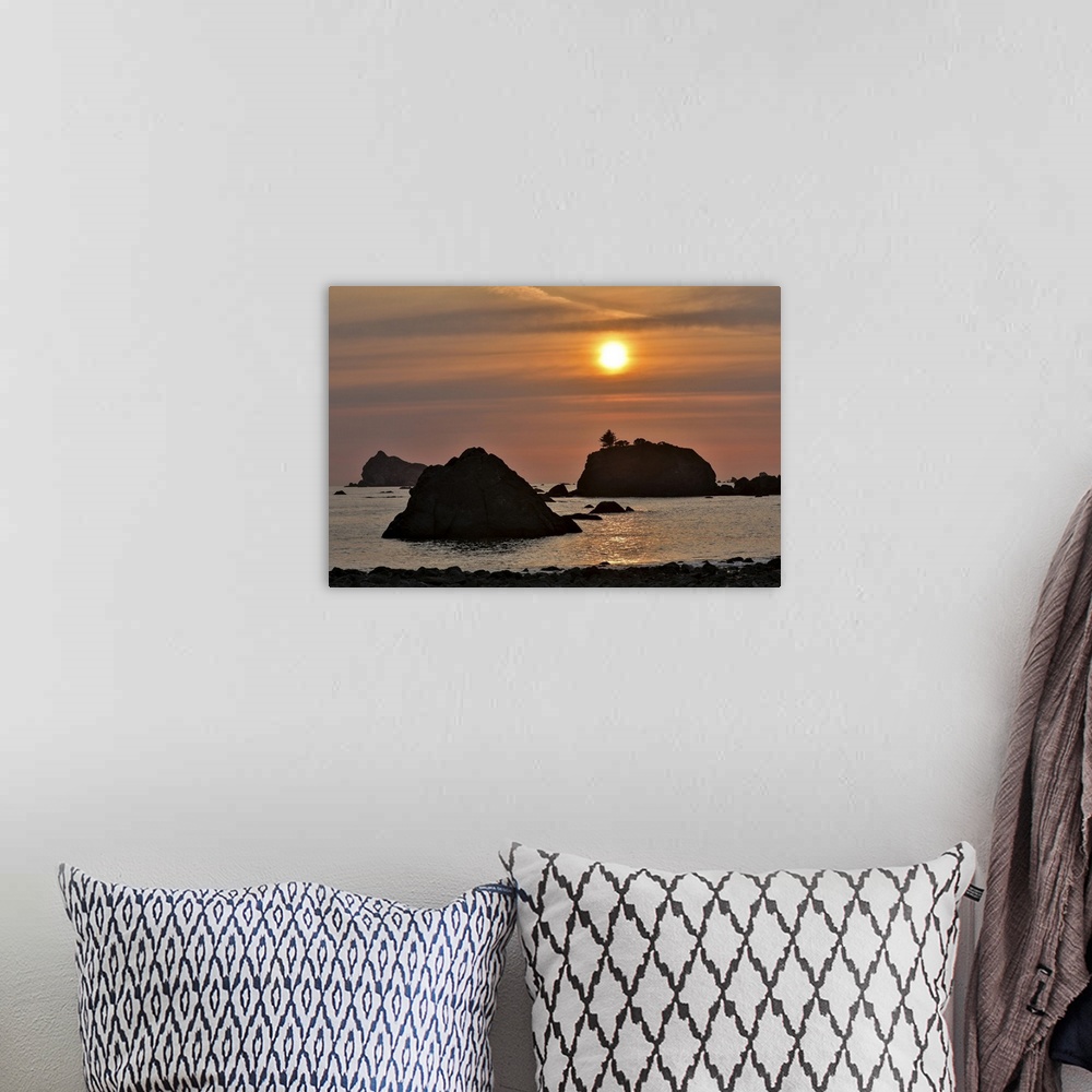 A bohemian room featuring Sunset and sea stacks along the Northern California coastline, Crescent City