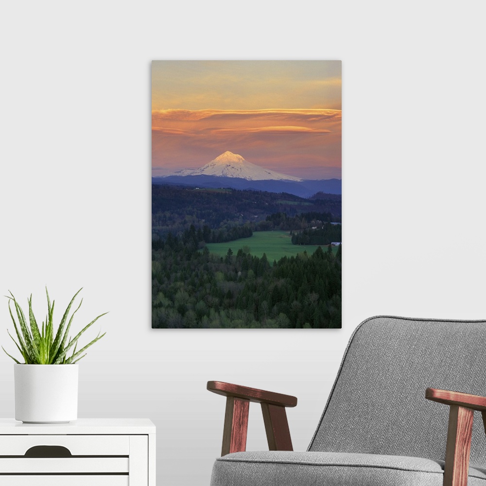 A modern room featuring Sunset light colors clouds over Mt Hood, Oregon Cascades.