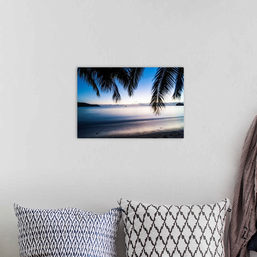 A bohemian room featuring Sunset over the beach, Naviti, Yasawa, Fiji, South Pacific.