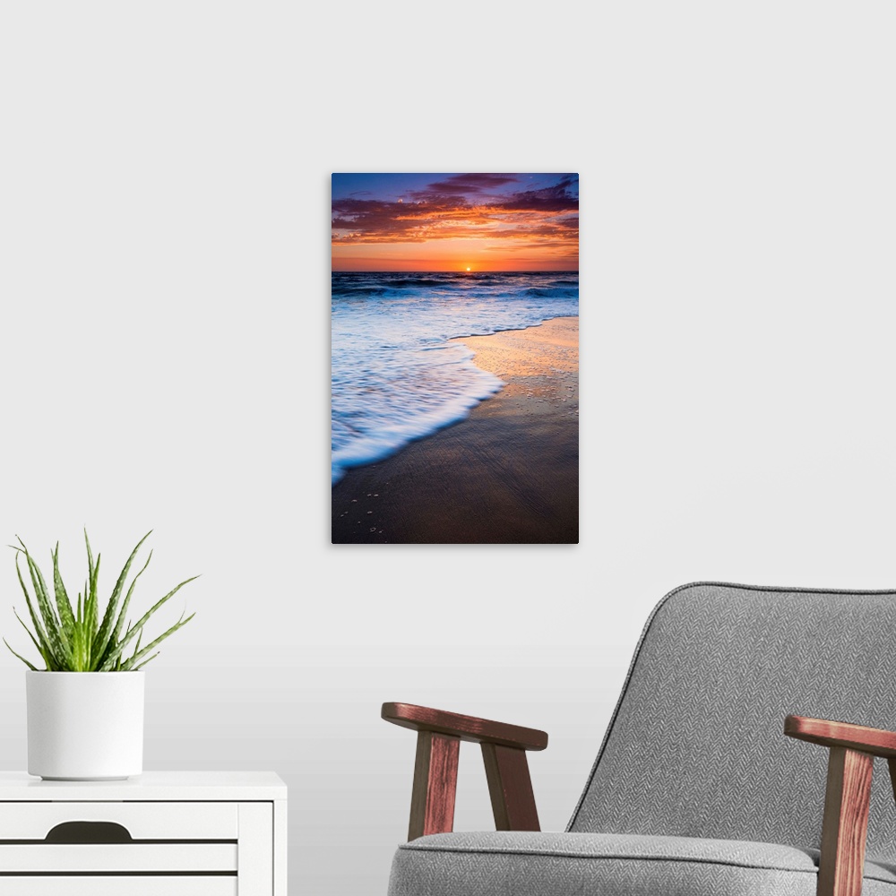 A modern room featuring Sunset over the Pacific Ocean from Ventura State Beach, Ventura, California USA.