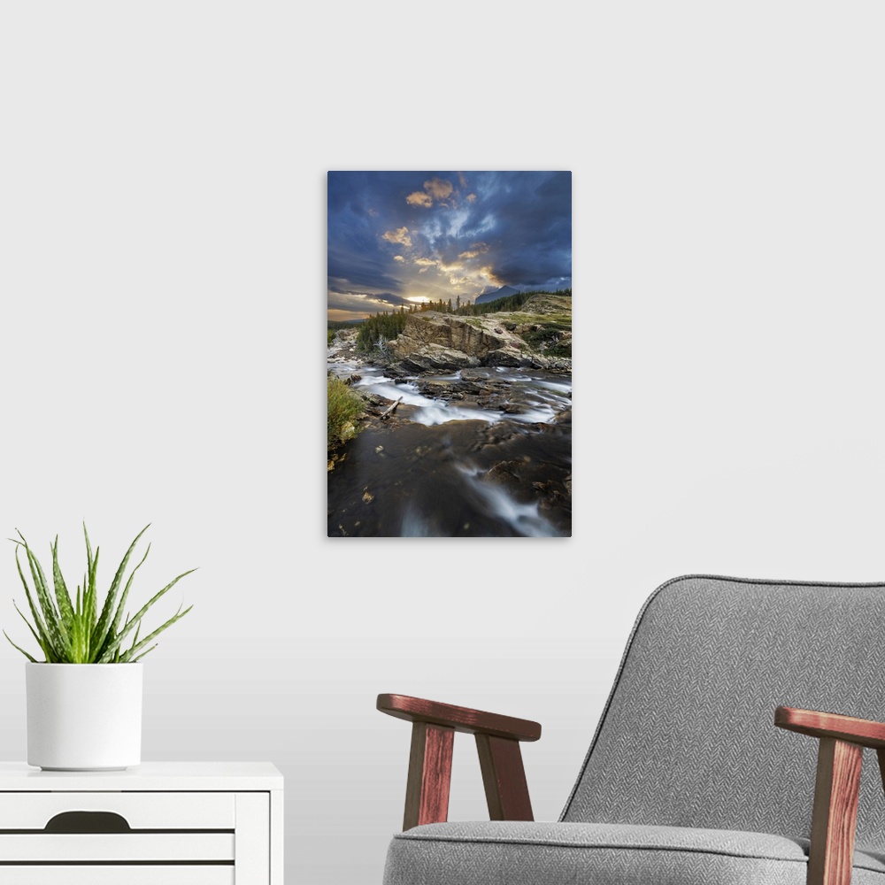 A modern room featuring Swiftcurrent Falls at sunrise in Glacier National Park, Montana, USA.