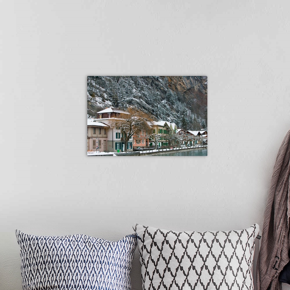 A bohemian room featuring SWITZERLAND-Bern-INTERLAKEN:Town Buildings along Aare River / Winter