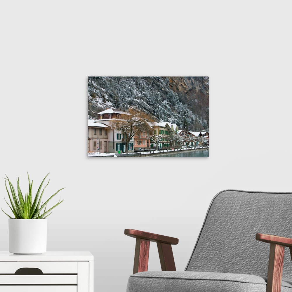 A modern room featuring SWITZERLAND-Bern-INTERLAKEN:Town Buildings along Aare River / Winter