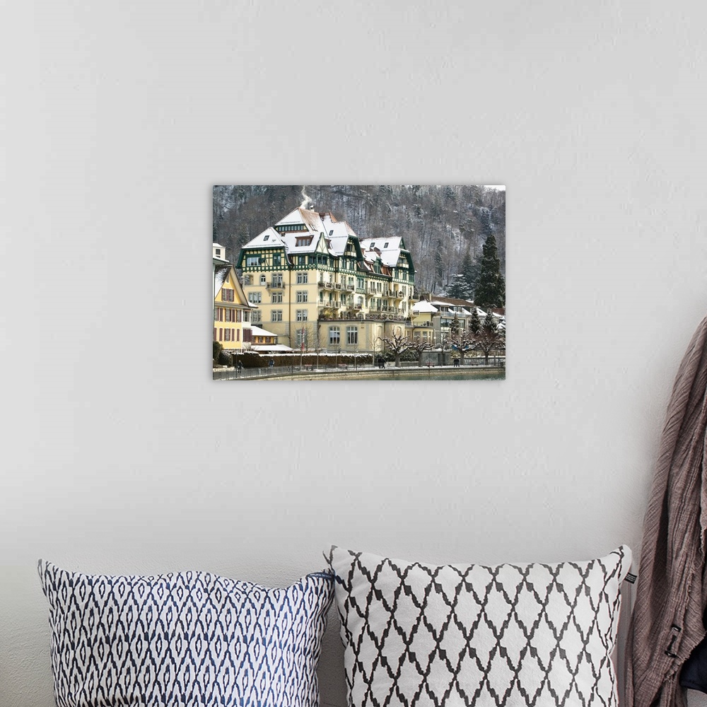 A bohemian room featuring SWITZERLAND-Bern-THUN:Town Buildings along Aare River / Winter