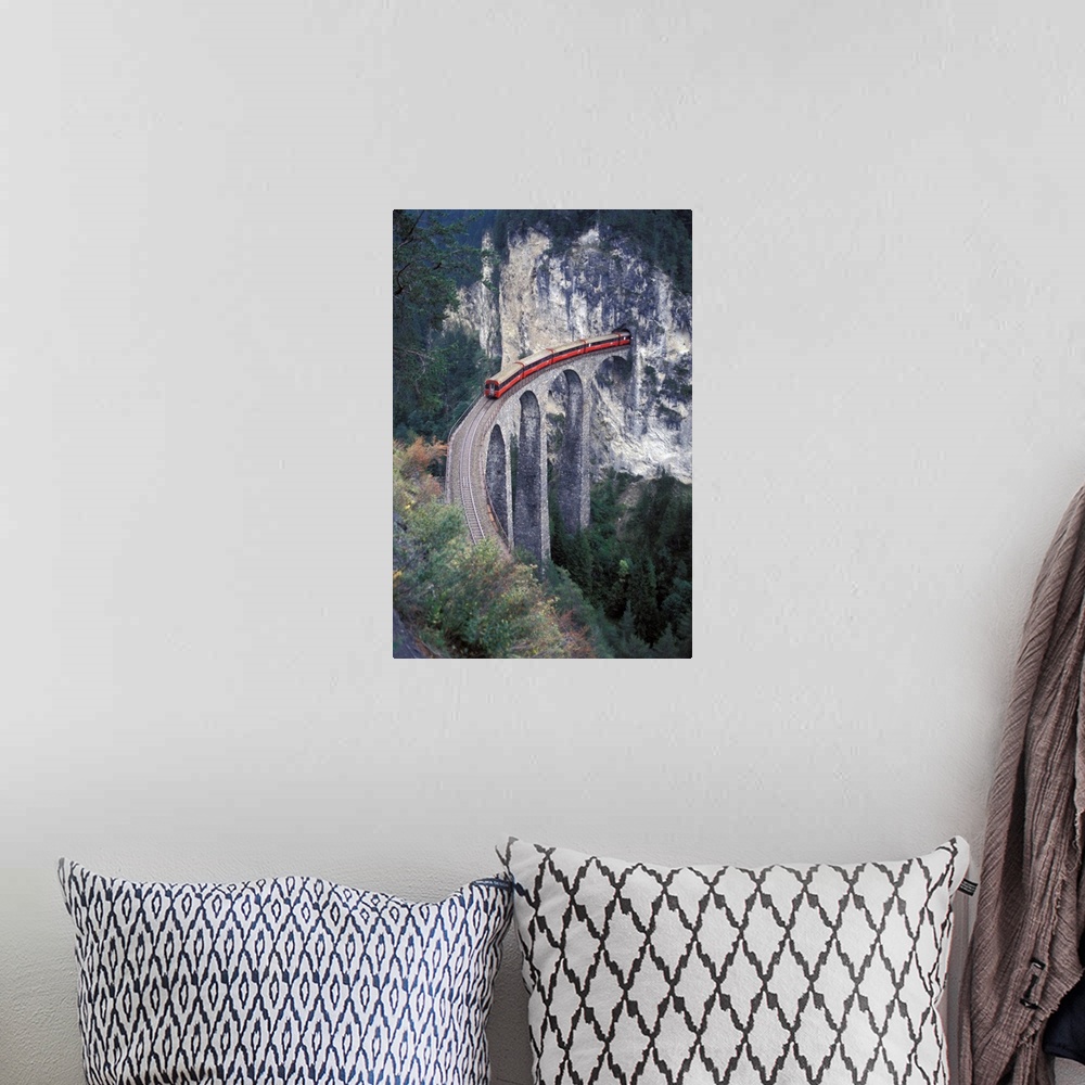 A bohemian room featuring Europe, Switzerland, Bernina Region, passenger train on the tallest rock bridge in Switzerland