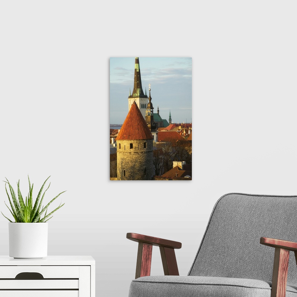 A modern room featuring Tallinn cityscape dominated by St. Olaf's Church and city wall towers, Estonia