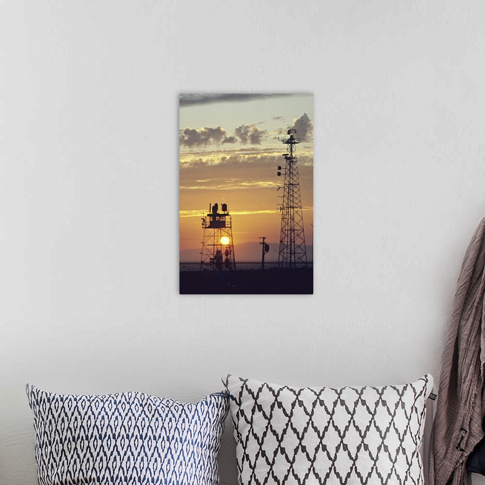 A bohemian room featuring Telecommunications antenna at sunset