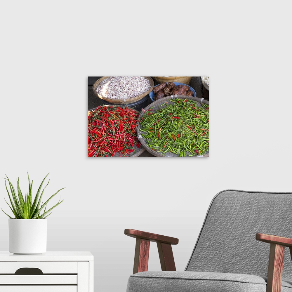 A modern room featuring Thailand, Chiang Mai. Thai street vendor of green and red Chilies.