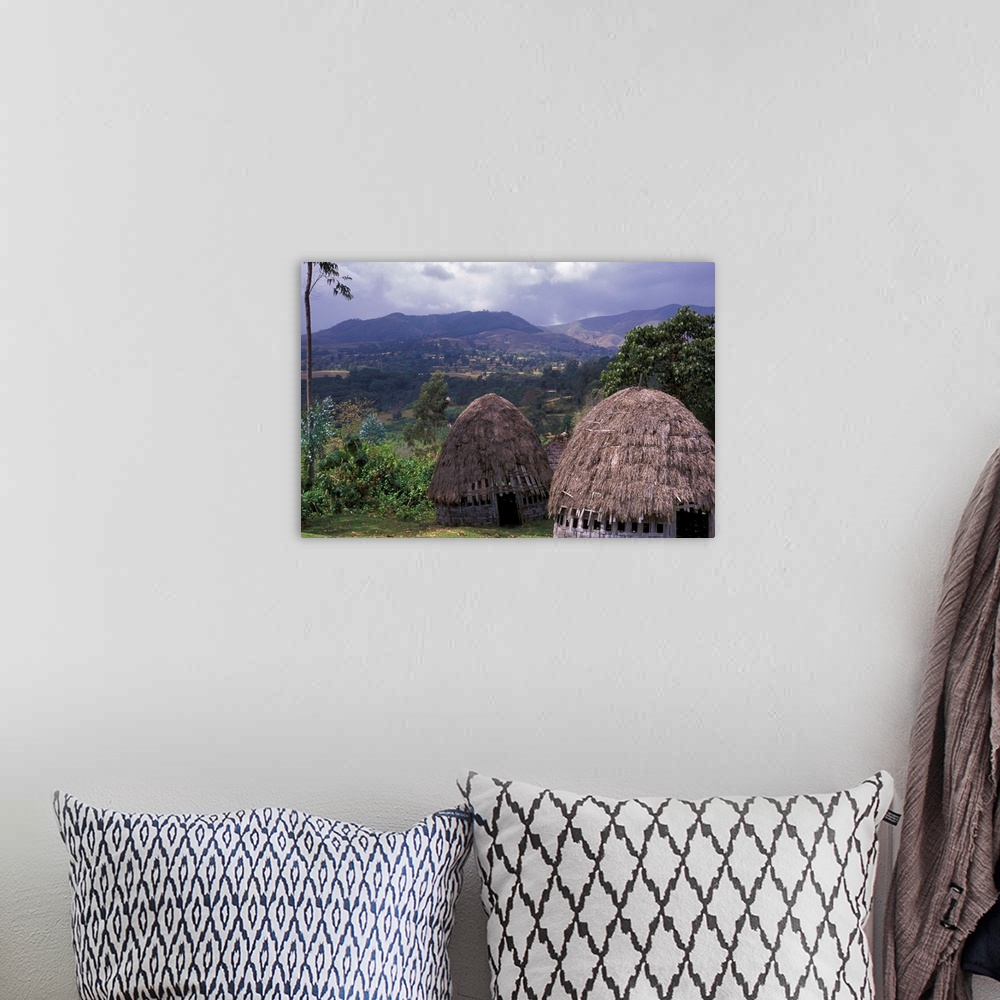A bohemian room featuring Africa, Ethiopia. Thatch huts of the Dorze tribe overlook the mountainous area of southern Ethiopia.