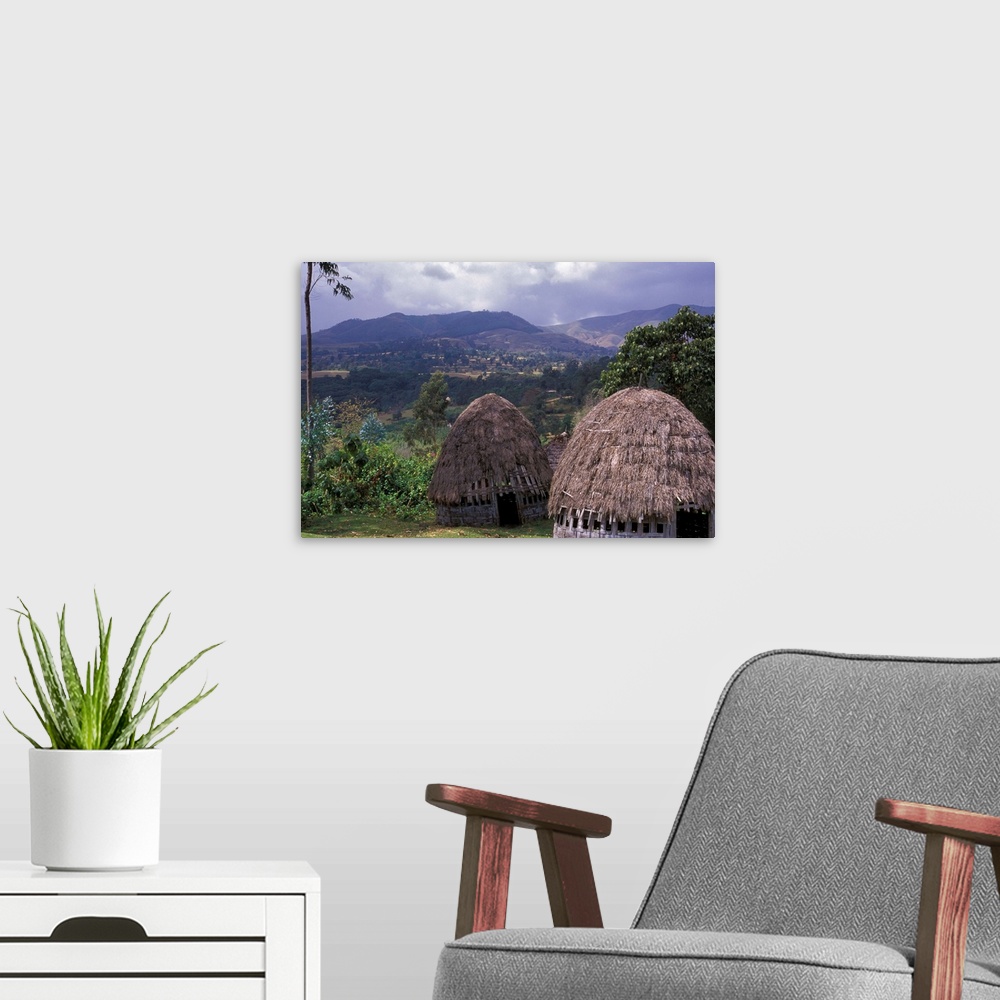 A modern room featuring Africa, Ethiopia. Thatch huts of the Dorze tribe overlook the mountainous area of southern Ethiopia.