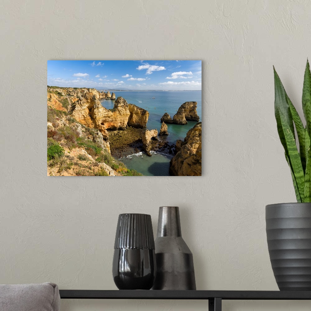 A modern room featuring The cliffs and sea stacks of Ponta da Piedade at the rocky coast of the Algarve in Portugal. Euro...