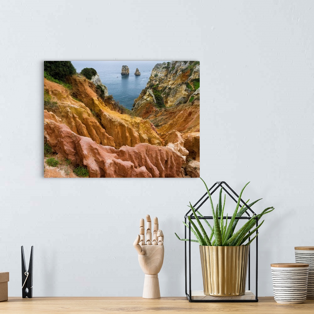 A bohemian room featuring The cliffs and sea stacks of Ponta da Piedade at the rocky coast of the Algarve in Portugal. Euro...