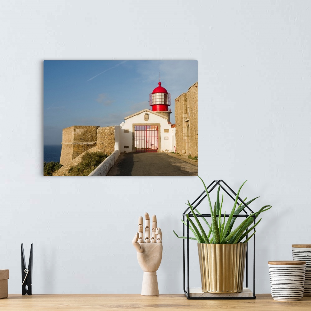 A bohemian room featuring Cabo de Sao Vincente (Cape St. Vincent) with its lighthouse at the rocky coast of the Algarve in ...