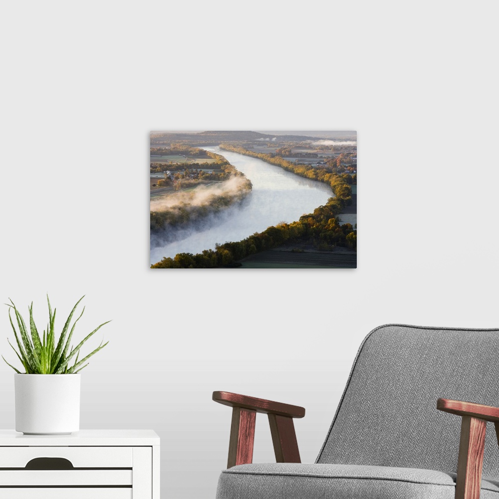 A modern room featuring The Connecticut River at dawn as seen from South Sugarloaf Mountain in the Sugarloaf Mountain Sta...