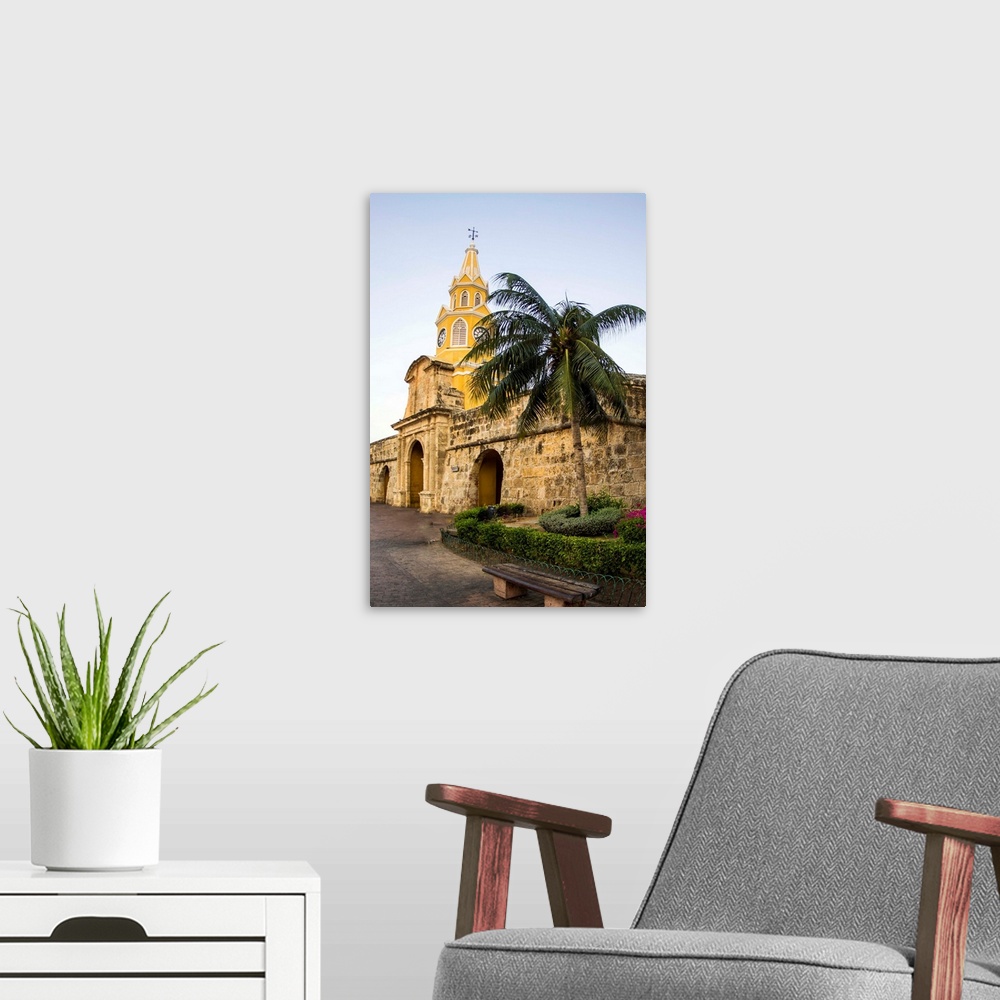 A modern room featuring South America, Colombia, Cartagena, The famed Clock Tower, Torre de Reloj, rises prominently in h...