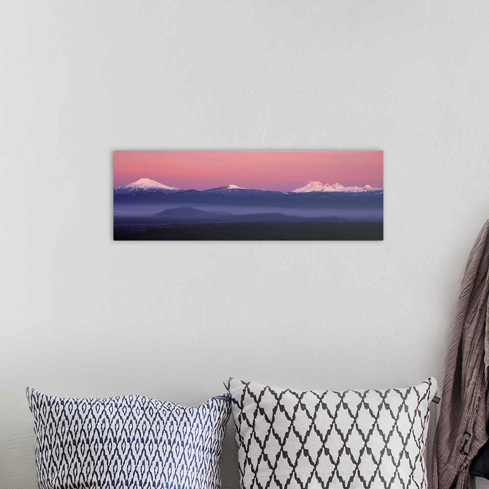 A bohemian room featuring USA, Oregon, Cascades Range. The pink blanket of sunrise warms the Oregon Cascades, as seen from ...