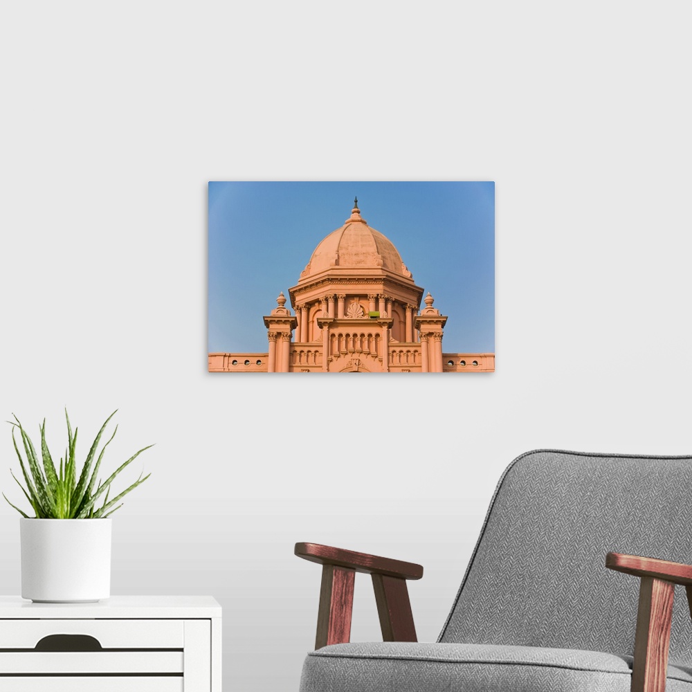 A modern room featuring The pink colored Ahsan Manzil palace in Dhaka, Bangladesh, Asia.