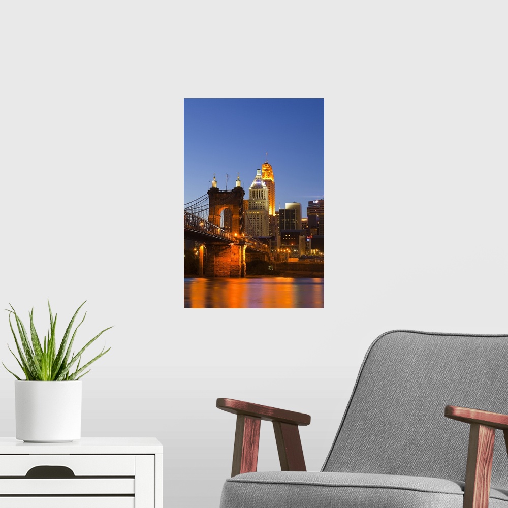 A modern room featuring The skyline of Cincinnati, Ohio, USA at dusk