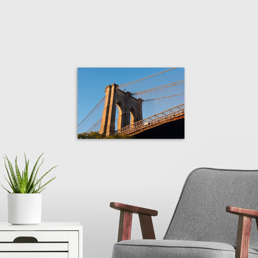 A modern room featuring The south tower of the iconic Brooklyn Bridge, New York City, New York